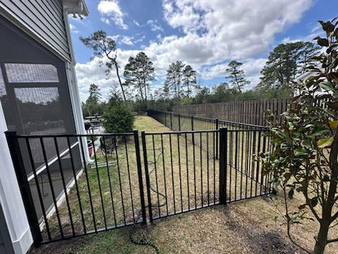 ornamental metal fence installed by top rail fence