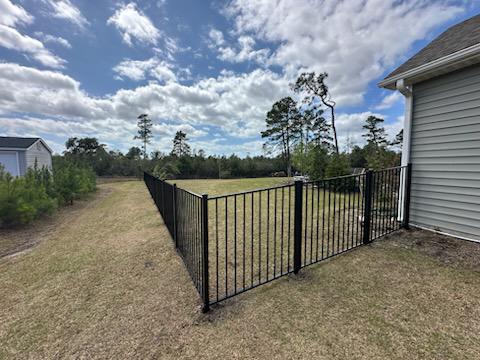 ornamental metal fence installed by top rail fence