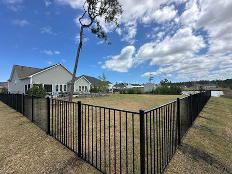 ornamental metal fence installed by top rail fence