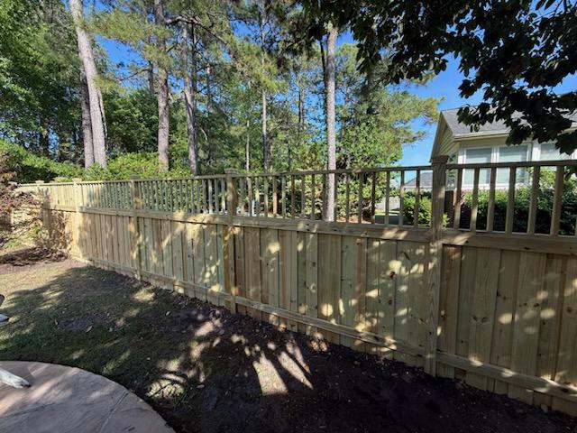 lattice top fence installed by top rail fence