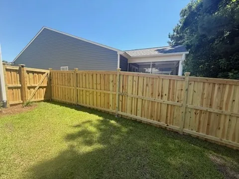 wood board on board fence installed by top rail fence
