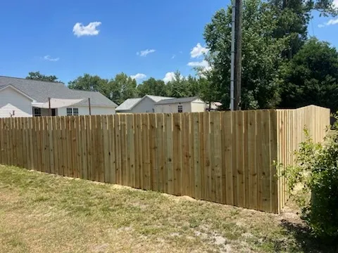 wood board on board fence installed by top rail fence