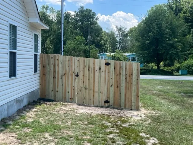 wood board on board fence installed by top rail fence