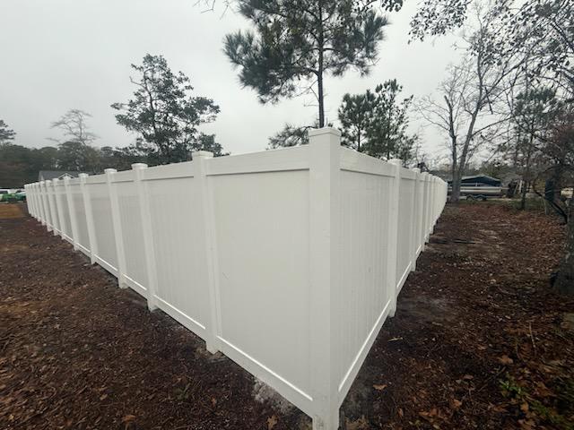 vinyl privacy fence installed by top rail fence