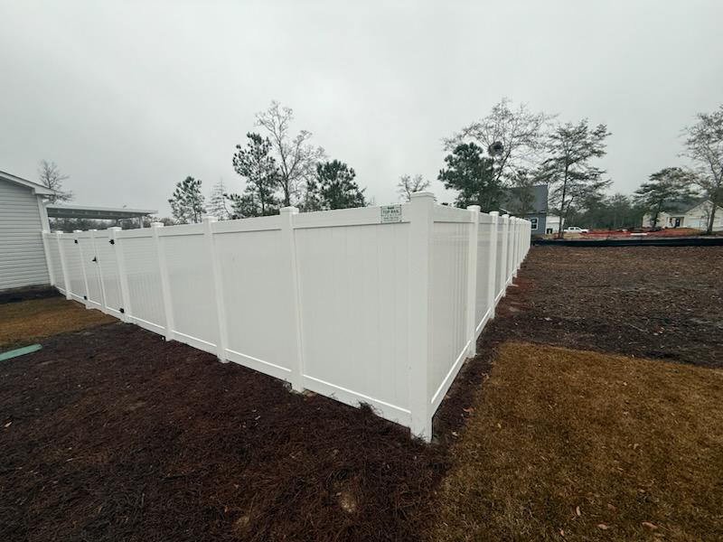 vinyl privacy fence installed by top rail fence