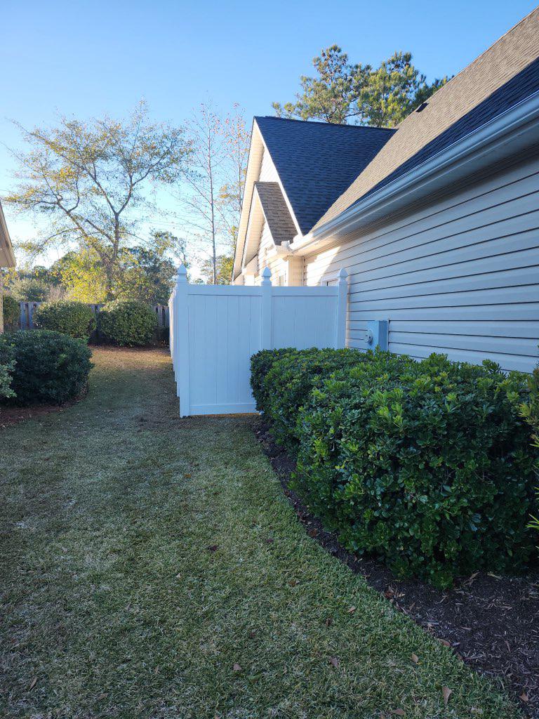 vinyl privacy fence installed by top rail fence