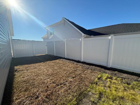 vinyl privacy fence installed by top rail fence