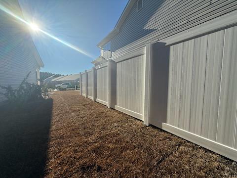 vinyl privacy fence installed by top rail fence
