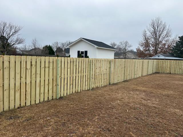 wood shadowbox fence installed by top rail fence