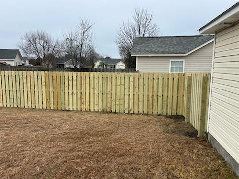 wood shadowbox fence installed by top rail fence