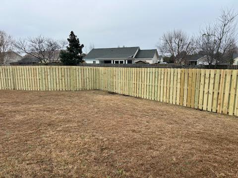 wood shadowbox fence installed by top rail fence