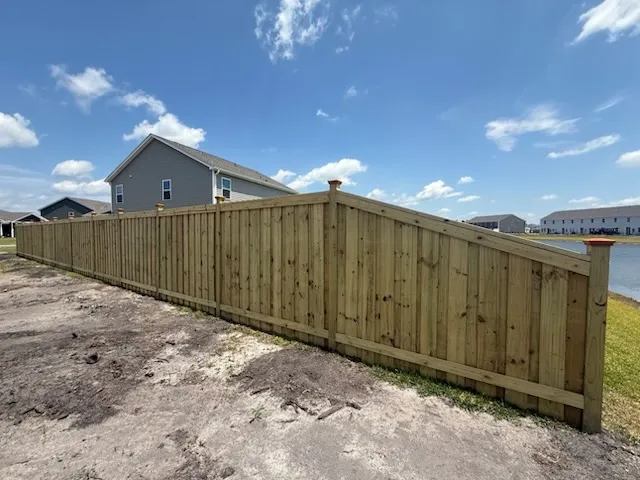 wood board on board fence installed by top rail fence