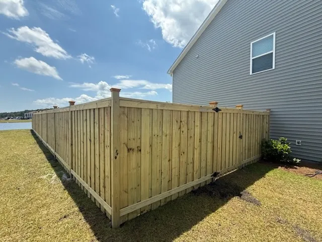 wood board on board fence installed by top rail fence