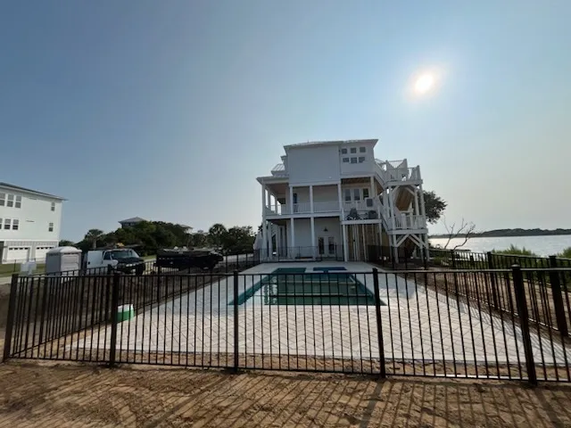 two rail ornamental metal fence installed by top rail fence