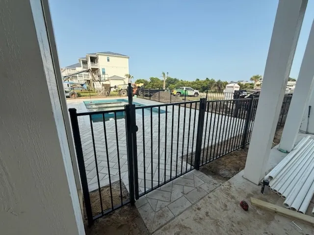 two rail ornamental metal fence installed by top rail fence