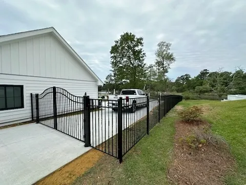 ornamental metal fence installed by top rail fence