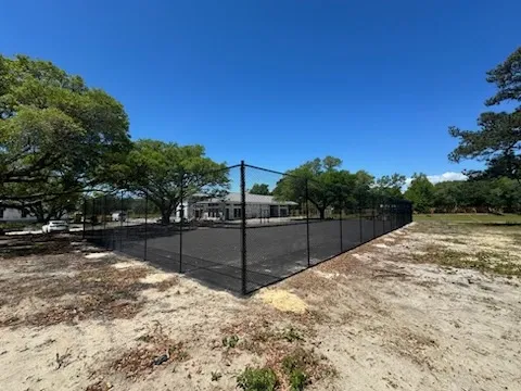 black chain link fence installed by top rail fence