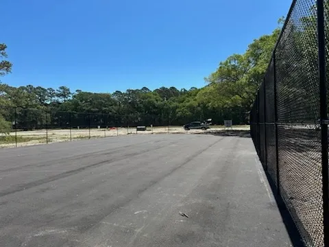 black chain link installed by top rail fence