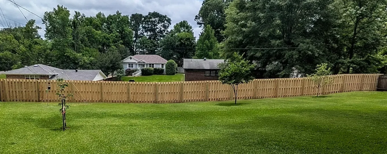 wood shadowbox fence installed by top rail fence