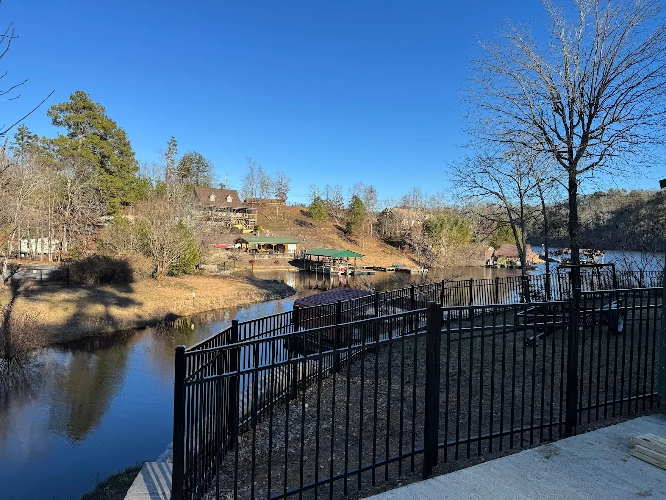 ornamental metal fence installed by top rail fence