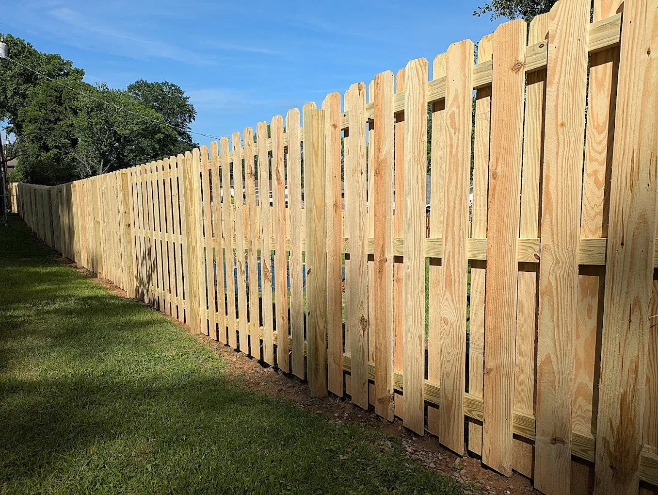 wood shadowbox fence installed by top rail fence