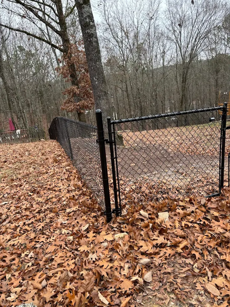 black chain link fence installed by top rail fence