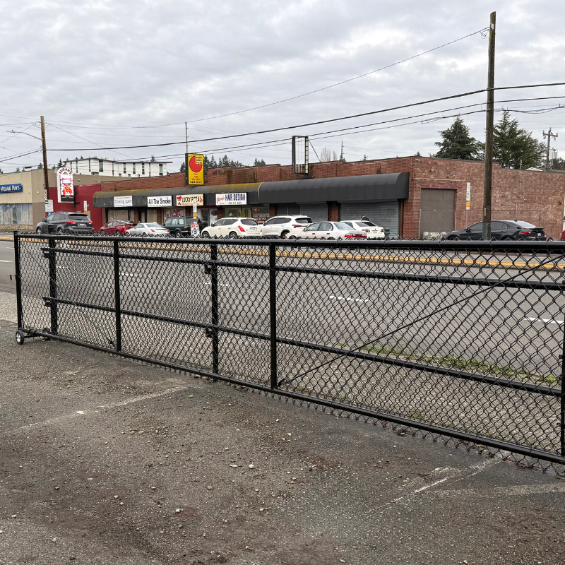 commercial black chain link fence installed by top rail fence