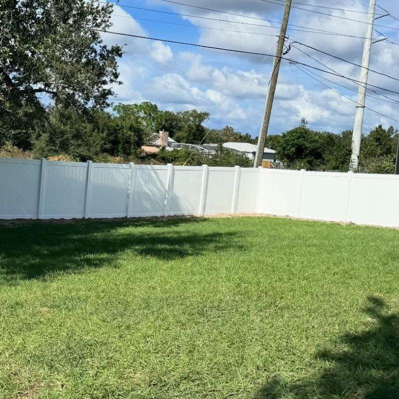 backyard with white vinyl fence