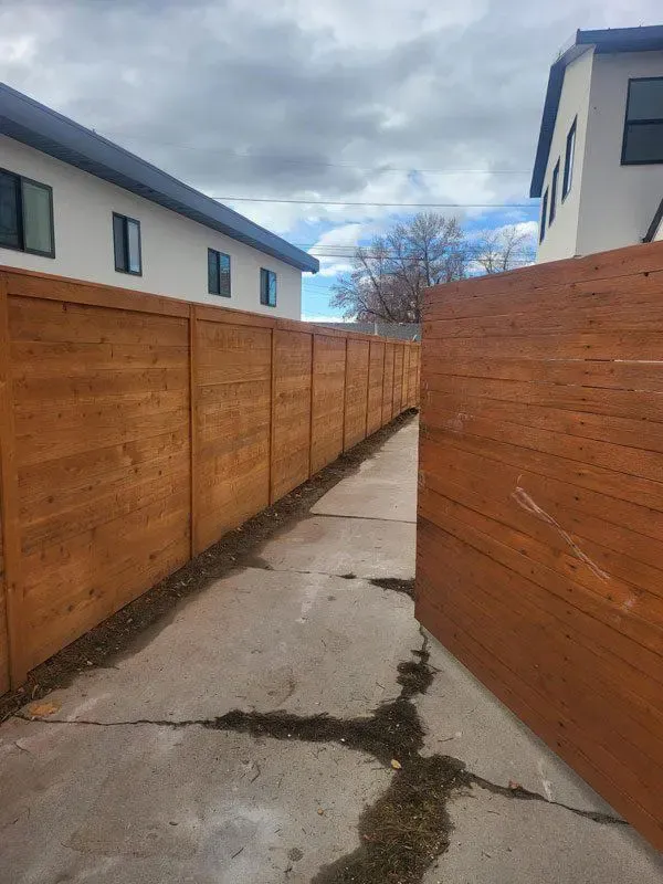tanned vinyl fence installed by top rail fence