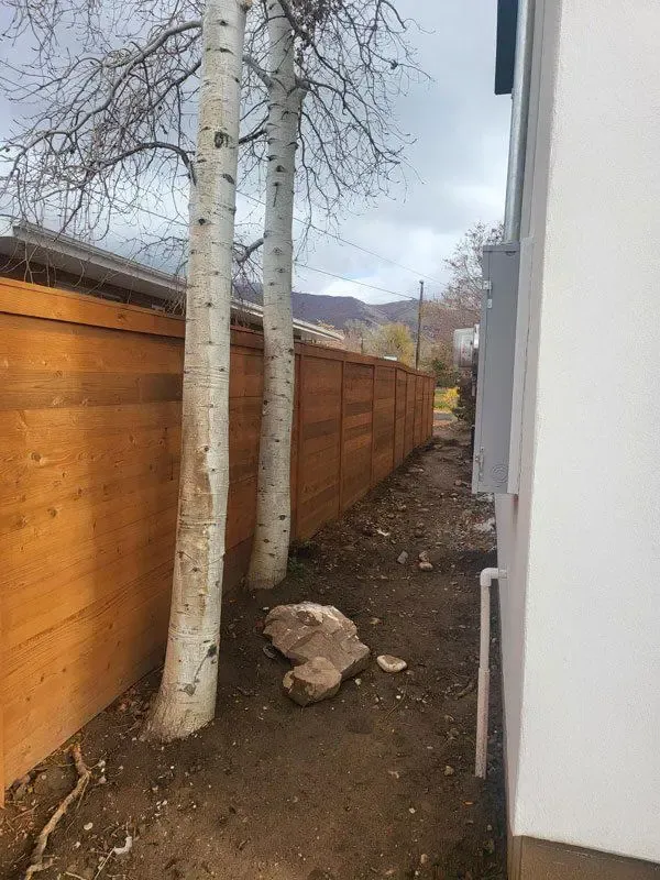 tanned vinyl fence installed by top rail fence
