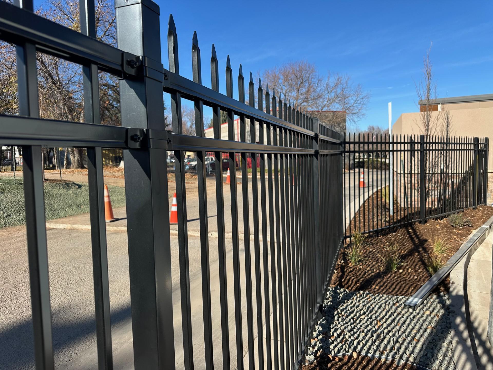 aluminum fence installed by top rail fence