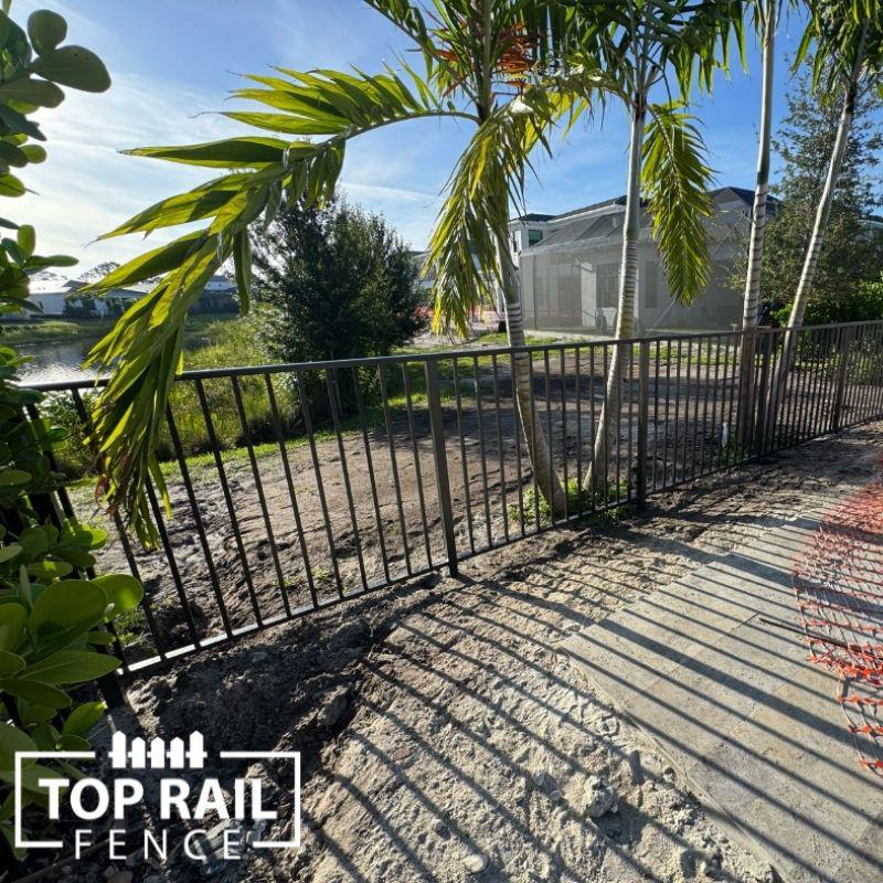 aluminum fence installed by top rail fence