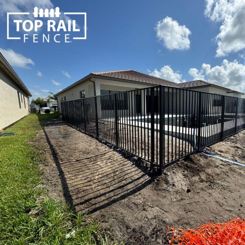 aluminum fence installed by top rail fence
