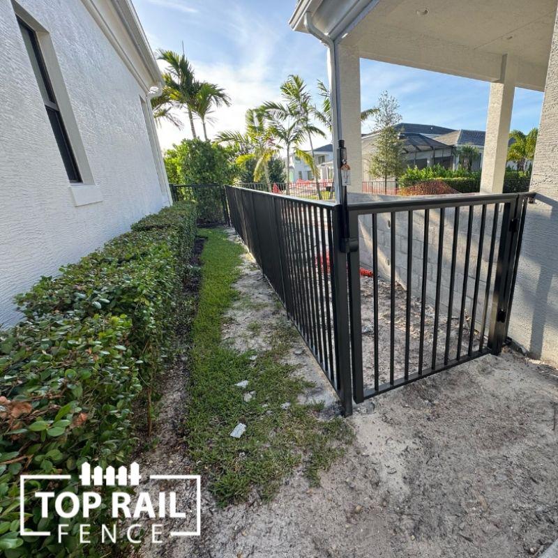 aluminum fence installed by top rail fence