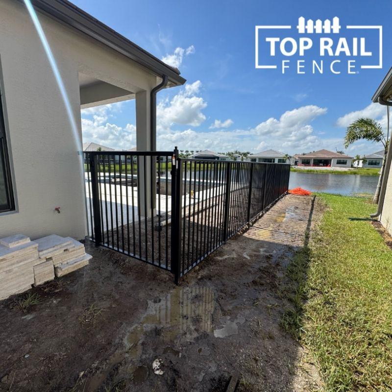 aluminum fence installed by top rail fence