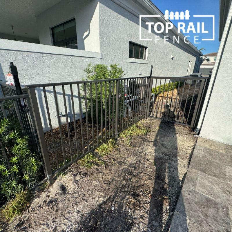 aluminum fence installed by top rail fence