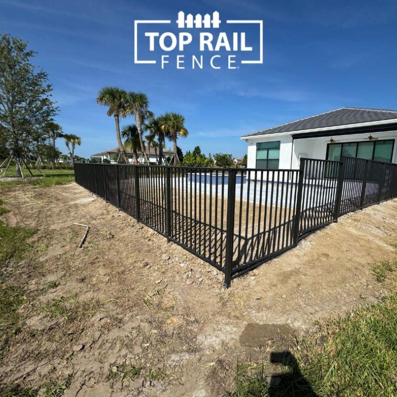 aluminum fence installed by top rail fence