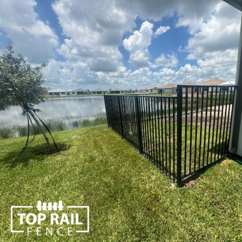 aluminum fence installed by top rail fence
