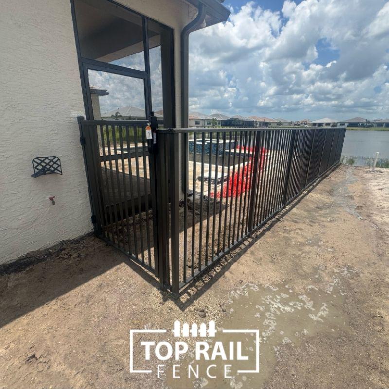 aluminum fence installed by top rail fence