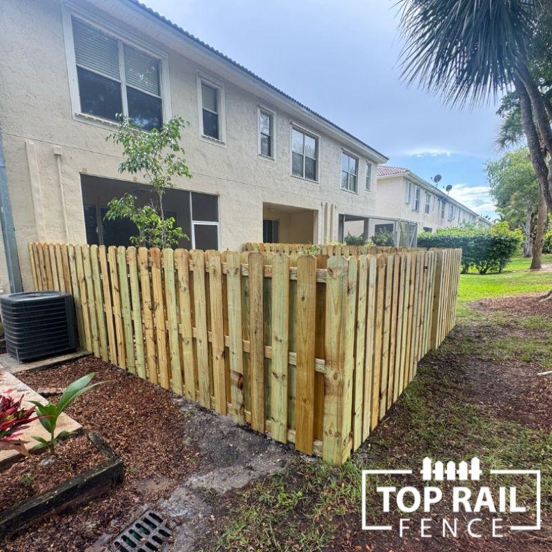 wood shadowbox fence installed by top rail fence