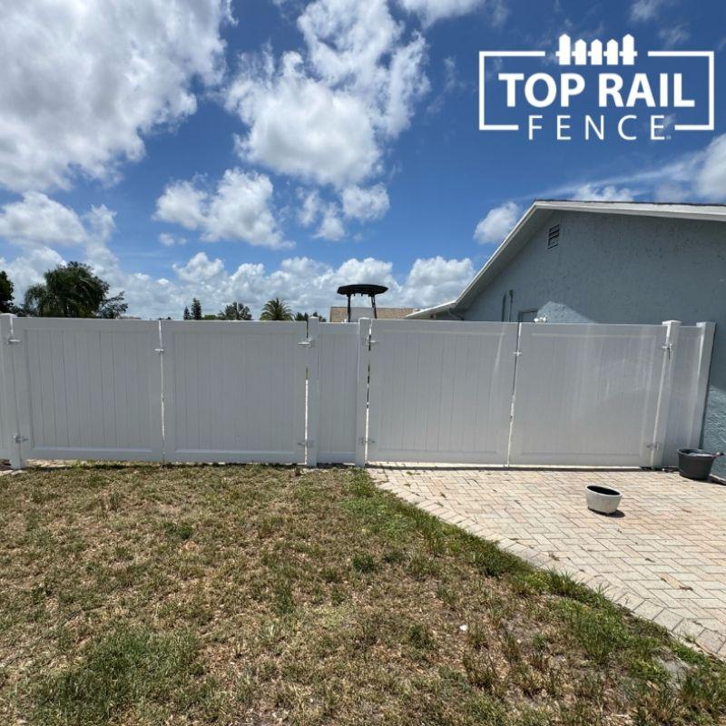 privacy vinyl fence installed by top rail fence