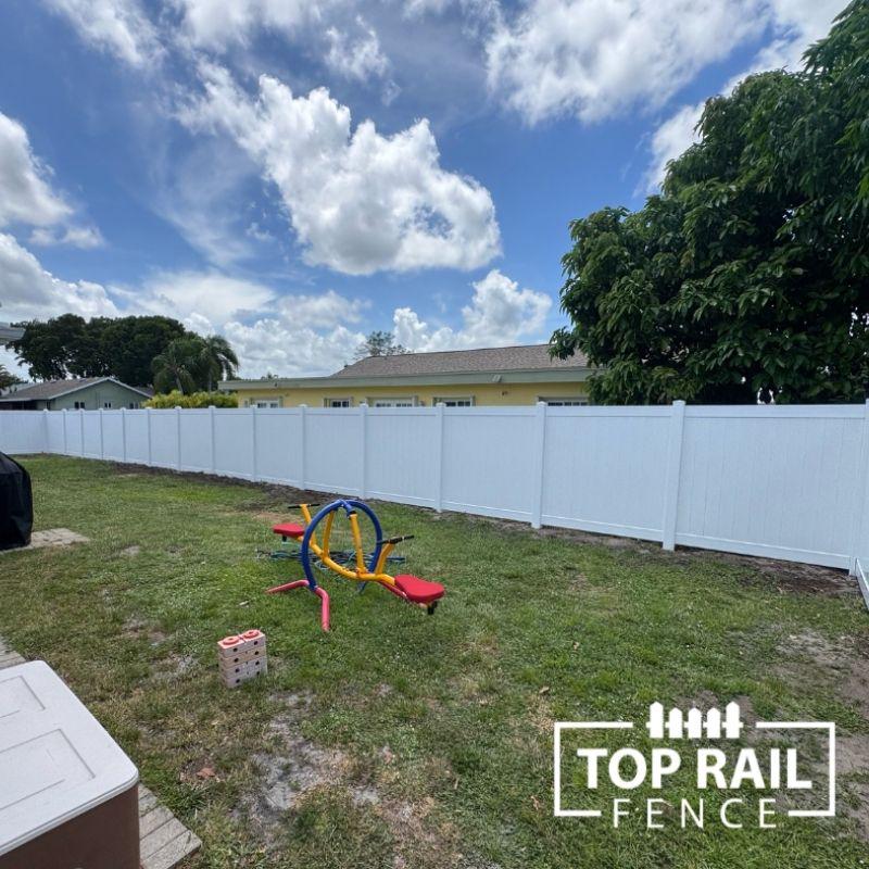 privacy vinyl fence installed by top rail fence