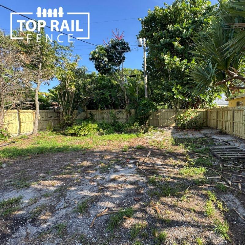 wood and aluminum fence installed by top rail fence