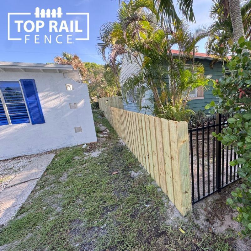 wood and aluminum fence installed by top rail fence