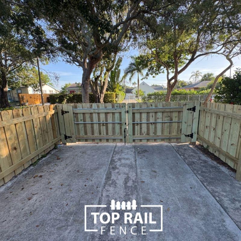 wood and aluminum fence installed by top rail fence