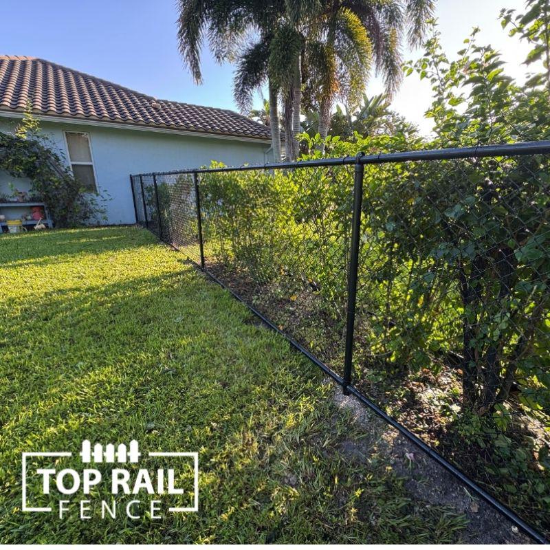 chain link fence installed by top rail fence