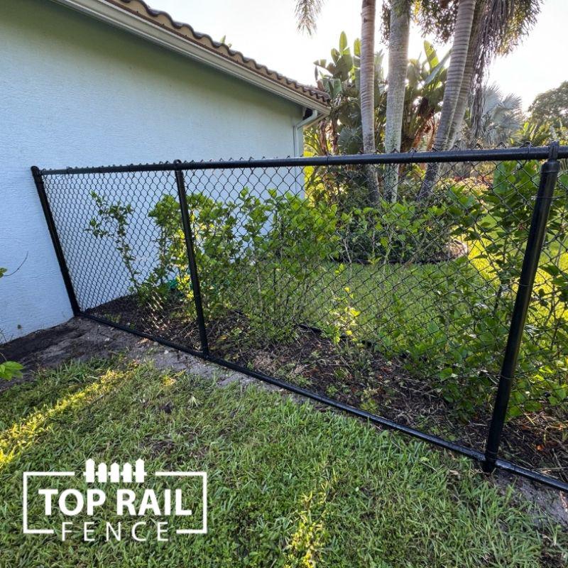 chain link fence installed by top rail fence