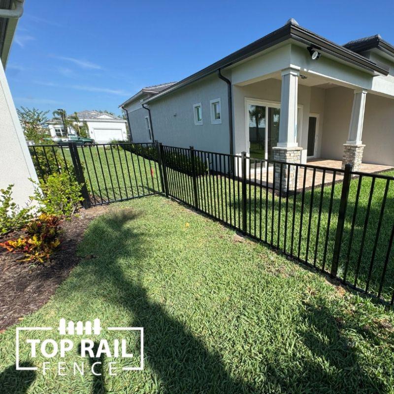 aluminum fence installed by top rail fence