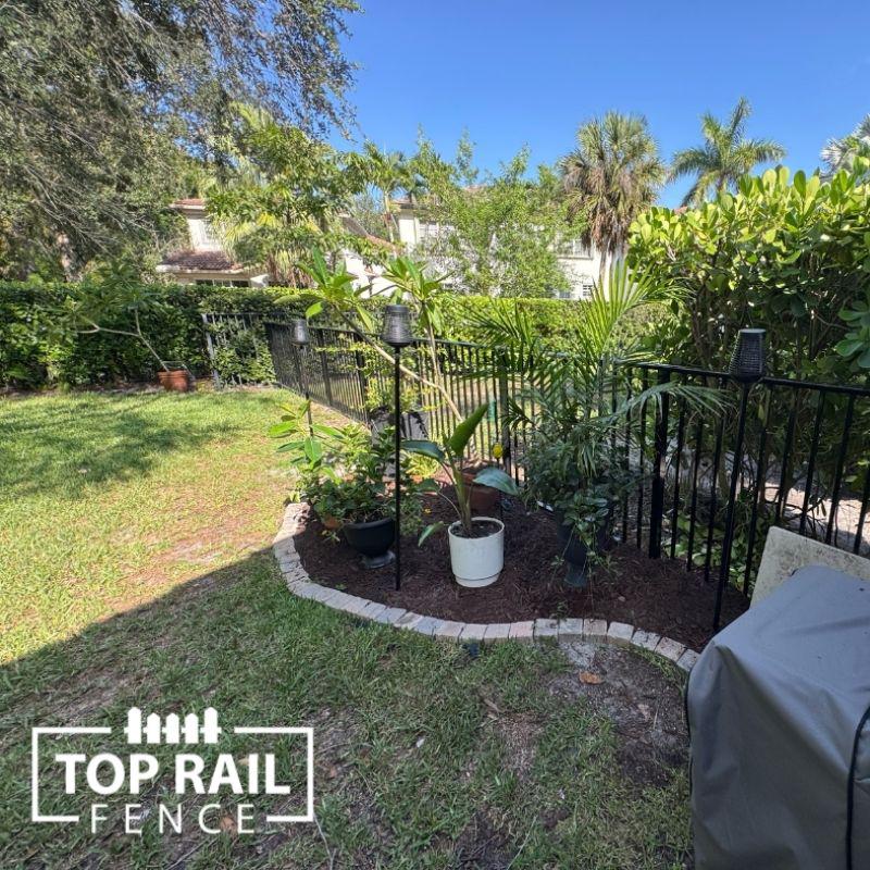 aluminum fence installed by top rail fence