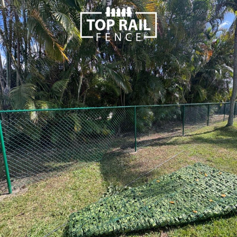 chain link fence installed by top rail fence